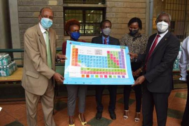 Handing over Kiswahili Periodic table to College of Humanities & Social Sciences.