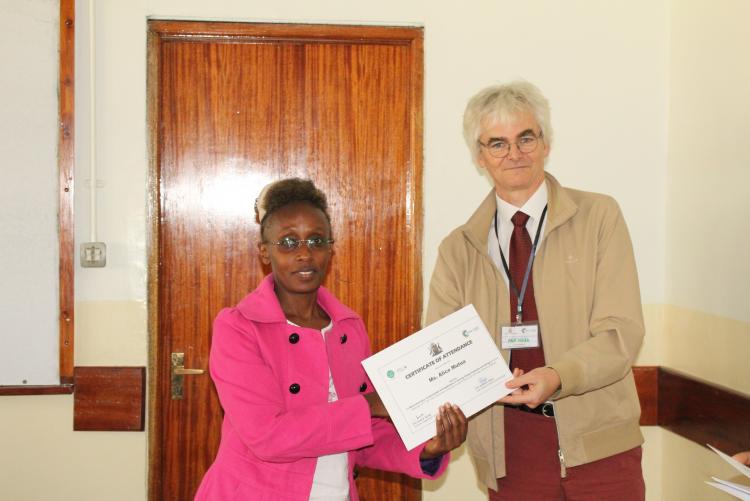 Ms. Alice Mutua receives her certificate