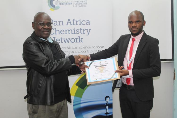 Mr. Swaleh receives certificate of participation from the Associate Dean, FST
