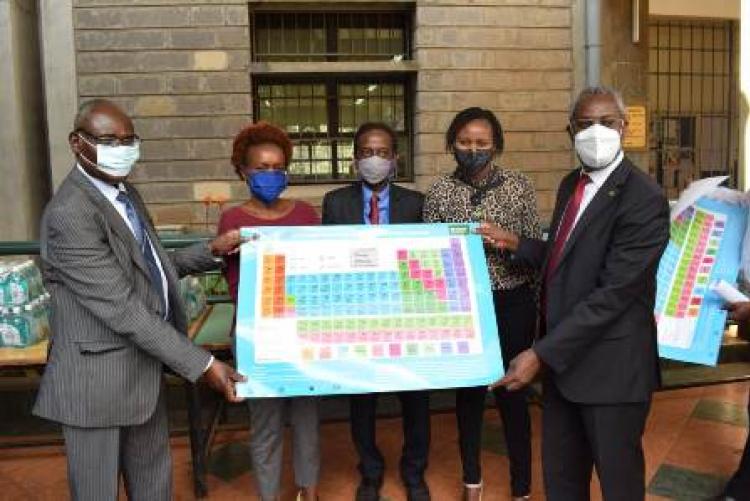 Handing over Kiswahili periodic table to the College of Biological & Physical Sciences
