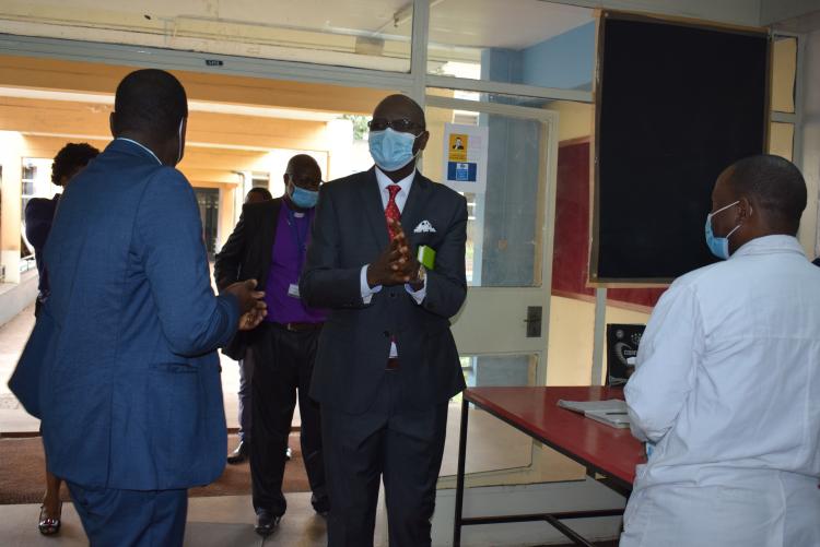DVC, Prof. Ochanda sanitizing his hands as he enter the Department