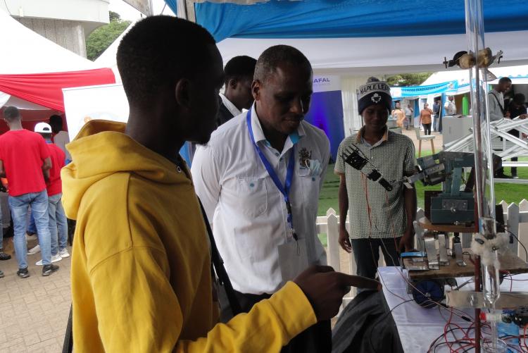 Dr. Mwaniki and Some Visitors to his stand
