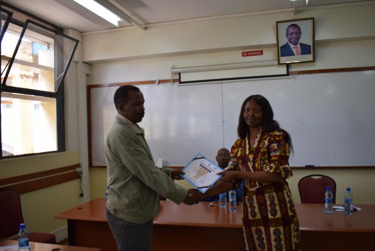Dean, FST awarding the certificate of one of the participants