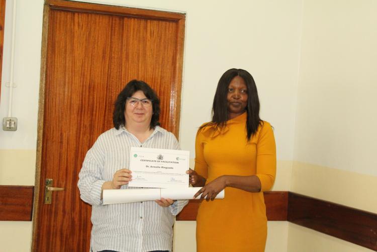 Dr. Armelle receiving her certificate