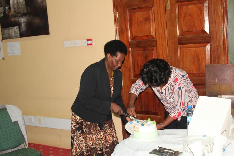 Cutting of the cake by Prof. Lydia Njenga, Porject Leader